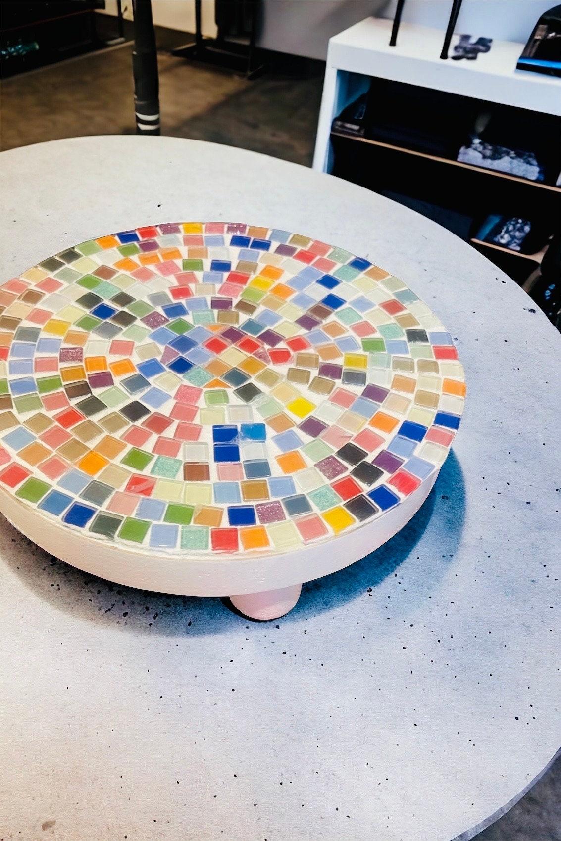Handcrafted white rainbow mosaic plant stand with colorful tiled design, perfect for displaying potted plants indoors or outdoors.