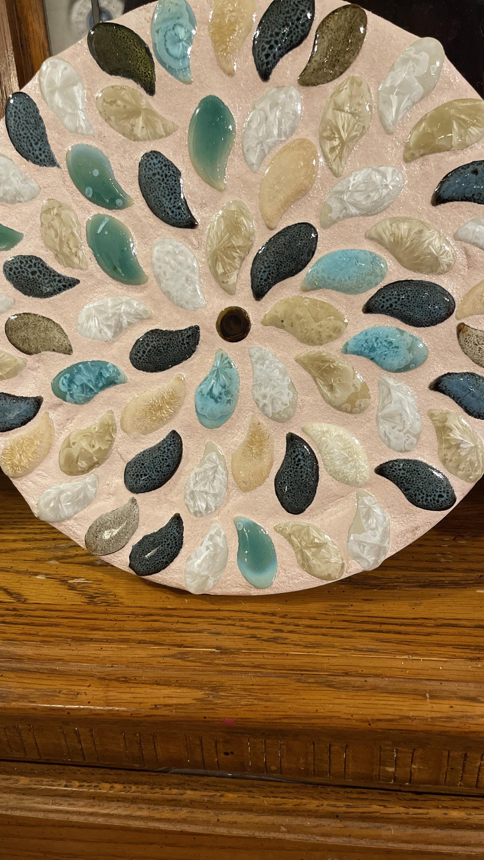 Handcrafted botanical petal mosaic plant stand with colorful floral design, perfect for indoor or outdoor décor.