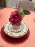 Handcrafted wooden mosaic plant stand with colorful tiled surface, designed for indoor or outdoor use by Miss Bette's Creations.
