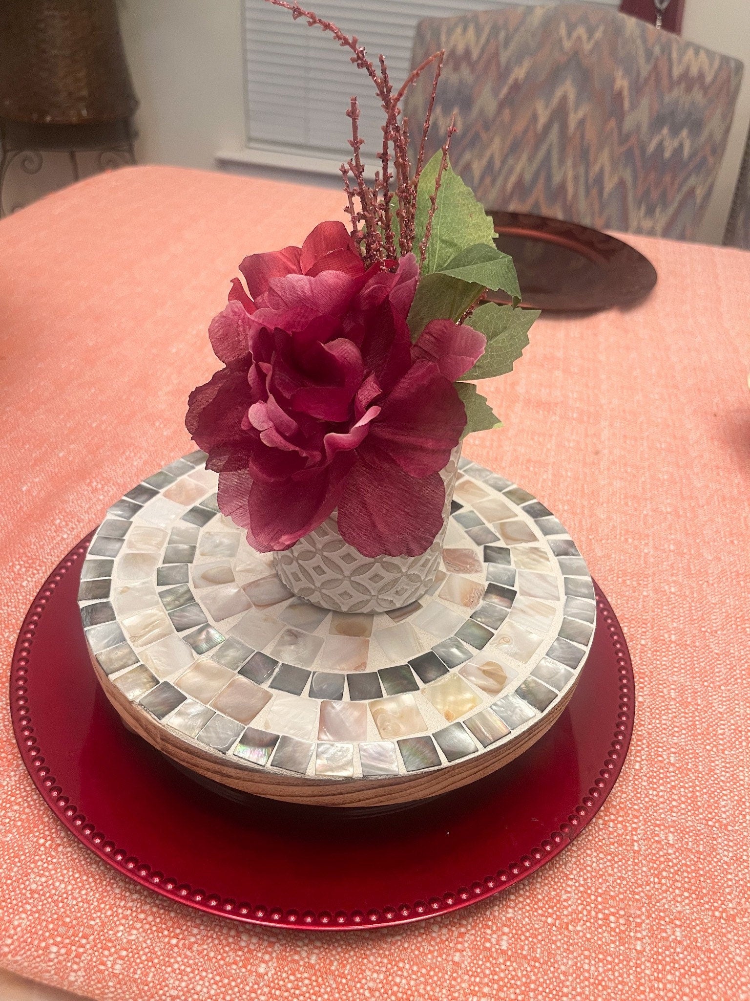 Handcrafted wooden mosaic plant stand with colorful tiled surface, designed for indoor or outdoor use by Miss Bette's Creations.