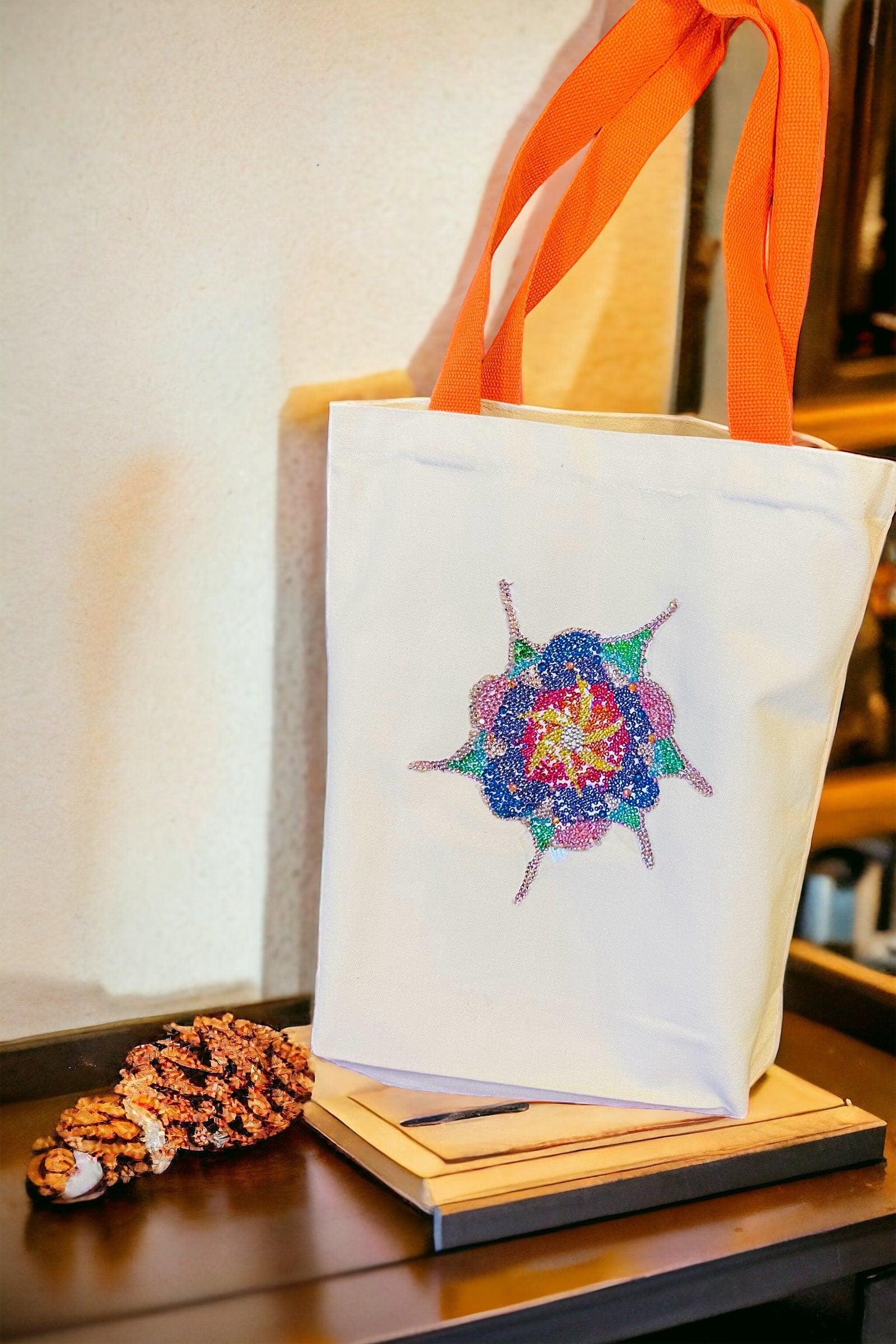 Handmade sparkling starburst diamond art canvas tote bag with a vibrant starburst design and sturdy handles.