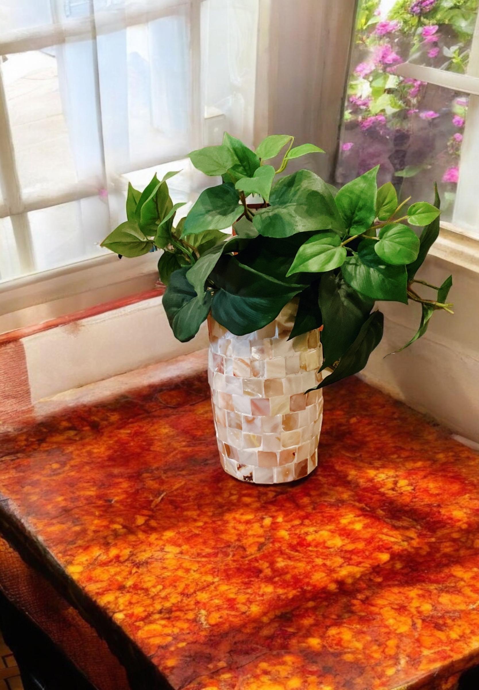 Ivory Coast Mother of Pearl cylindrical vase with iridescent finish, showcasing elegant craftsmanship and smooth design.