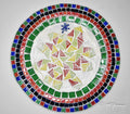 Artisan handcrafted round mosaic decorative plate with colorful tile patterns, ideal for wall display or tabletop decor.