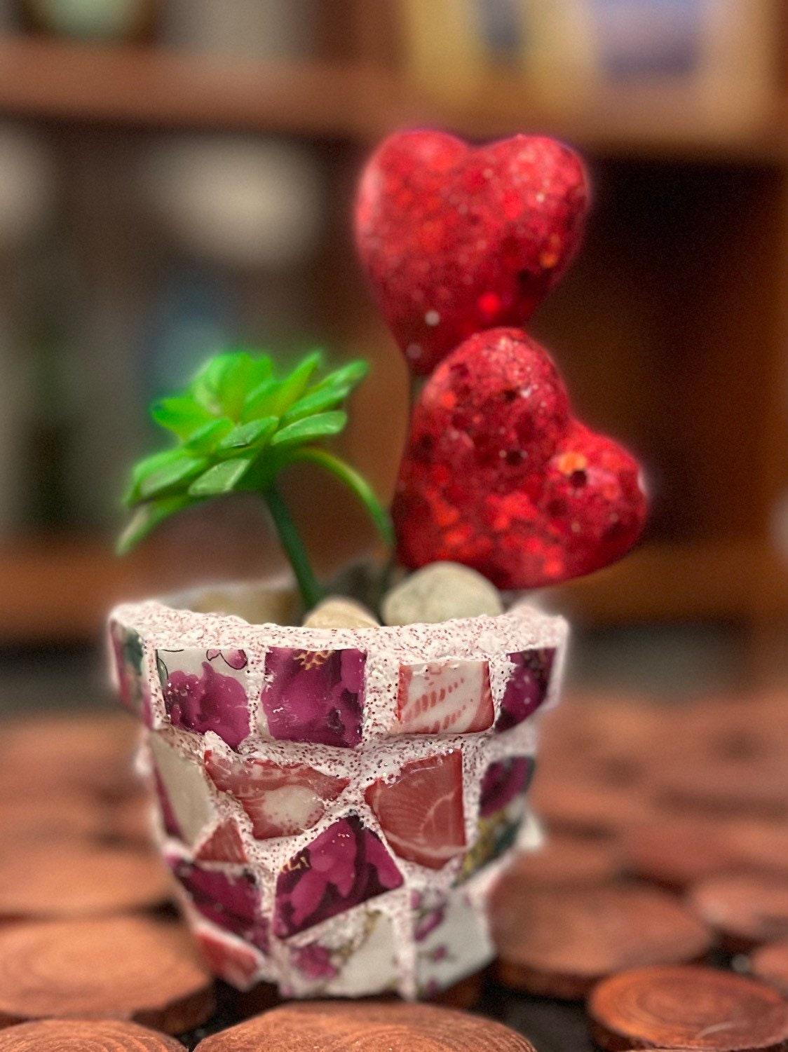 Handcrafted broken china heart mosaic planter with colorful ceramic pieces, designed for decorative indoor or outdoor use.