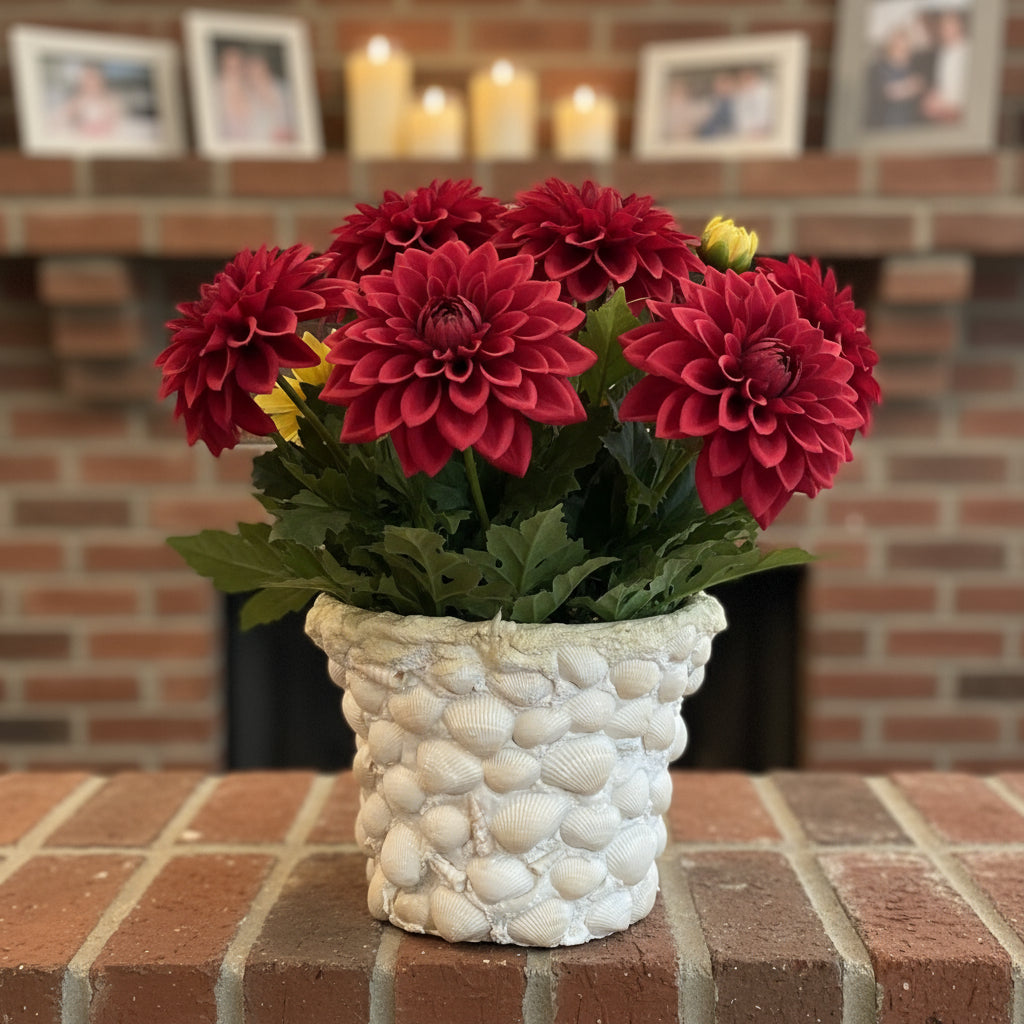Handcrafted seashell mosaic plant pot with colorful shell patterns, perfect for indoor or outdoor decorative gardening.