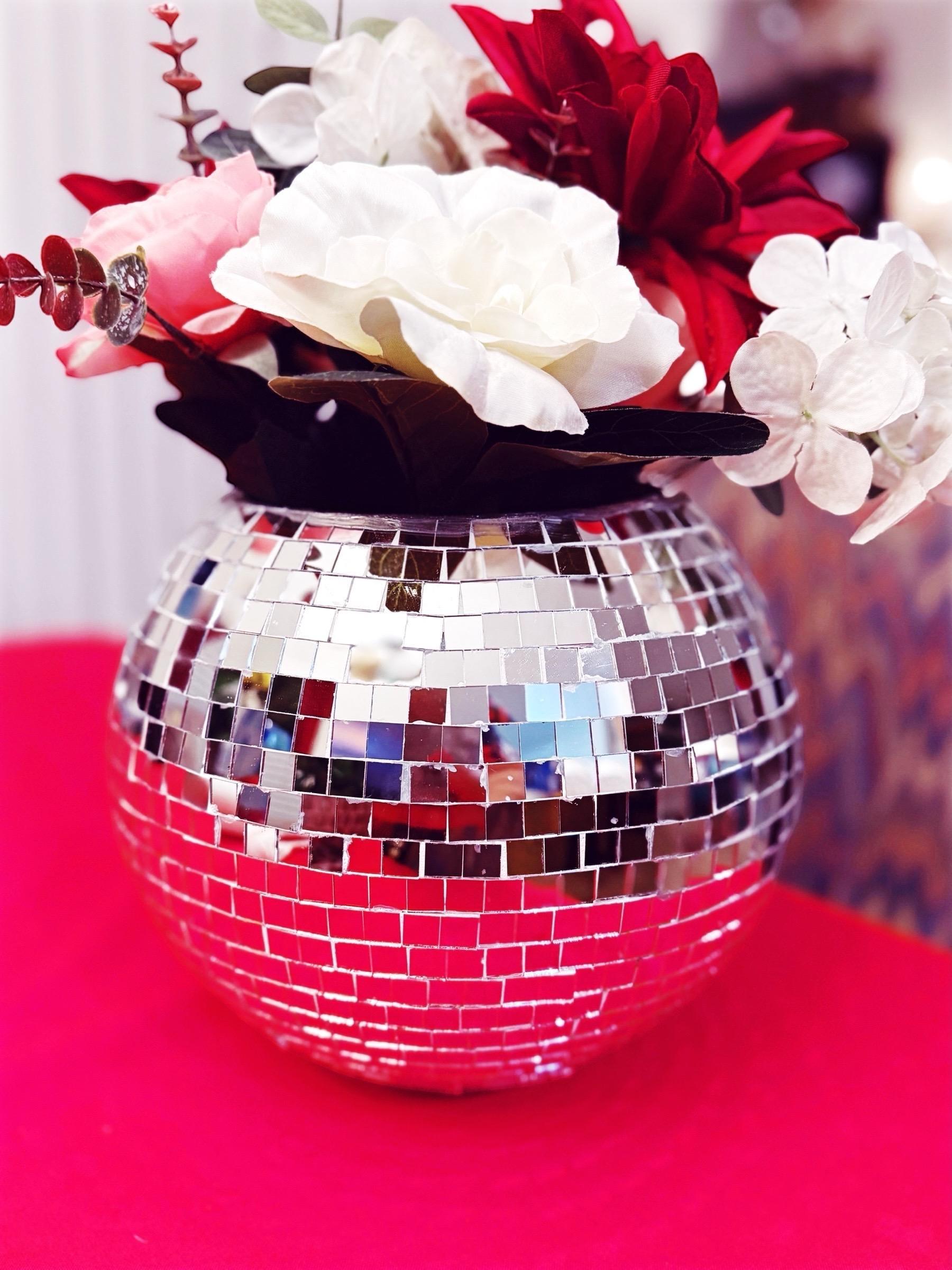 Mirror ball disco globe vase with reflective surface and spherical shape, perfect for modern home decor and floral arrangements.
