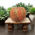 Vintage hand-carved wooden pedestal stand with intricate detailing, ideal for displaying art or decorative objects.