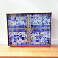 Artisan Ocean Blue mosaic serving tray with intricate tile pattern, handcrafted design, and wooden handles for serving and display.