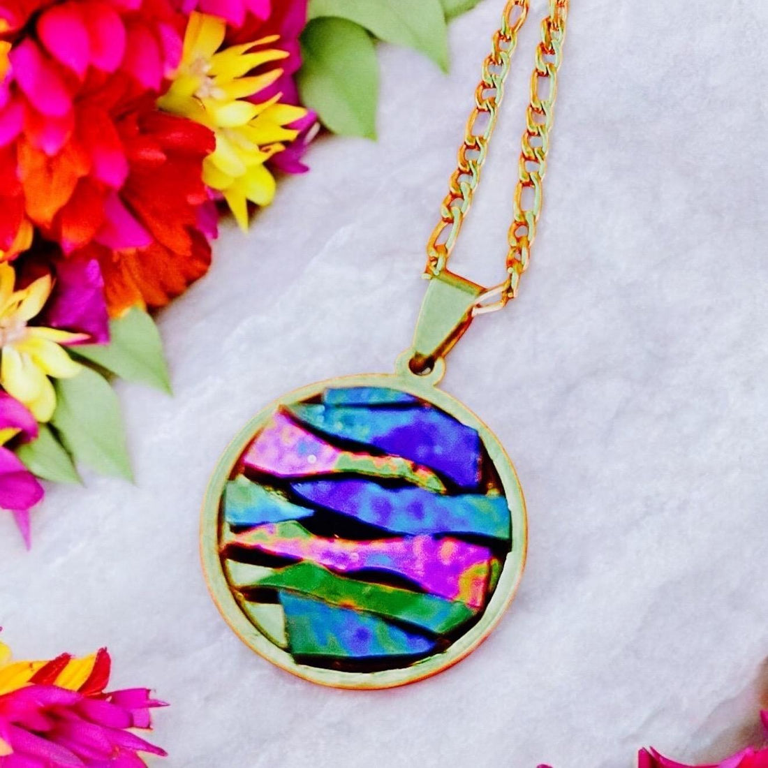 Colorful pendant necklace featuring vibrant beads and a silver chain, showcasing a stylish accessory for casual or dressy outfits.