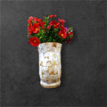 Handcrafted tapered mosaic vase with mother of pearl tiles, showcasing intricate mosaic design and elegant shape.