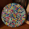 Handmade 7-inch rainbow mosaic plant stand with colorful tiled design, perfect for showcasing small potted plants.