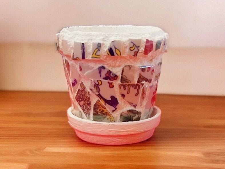 Handcrafted broken china mosaic planter with matching saucer, featuring colorful mosaic design for decorative indoor or outdoor use.