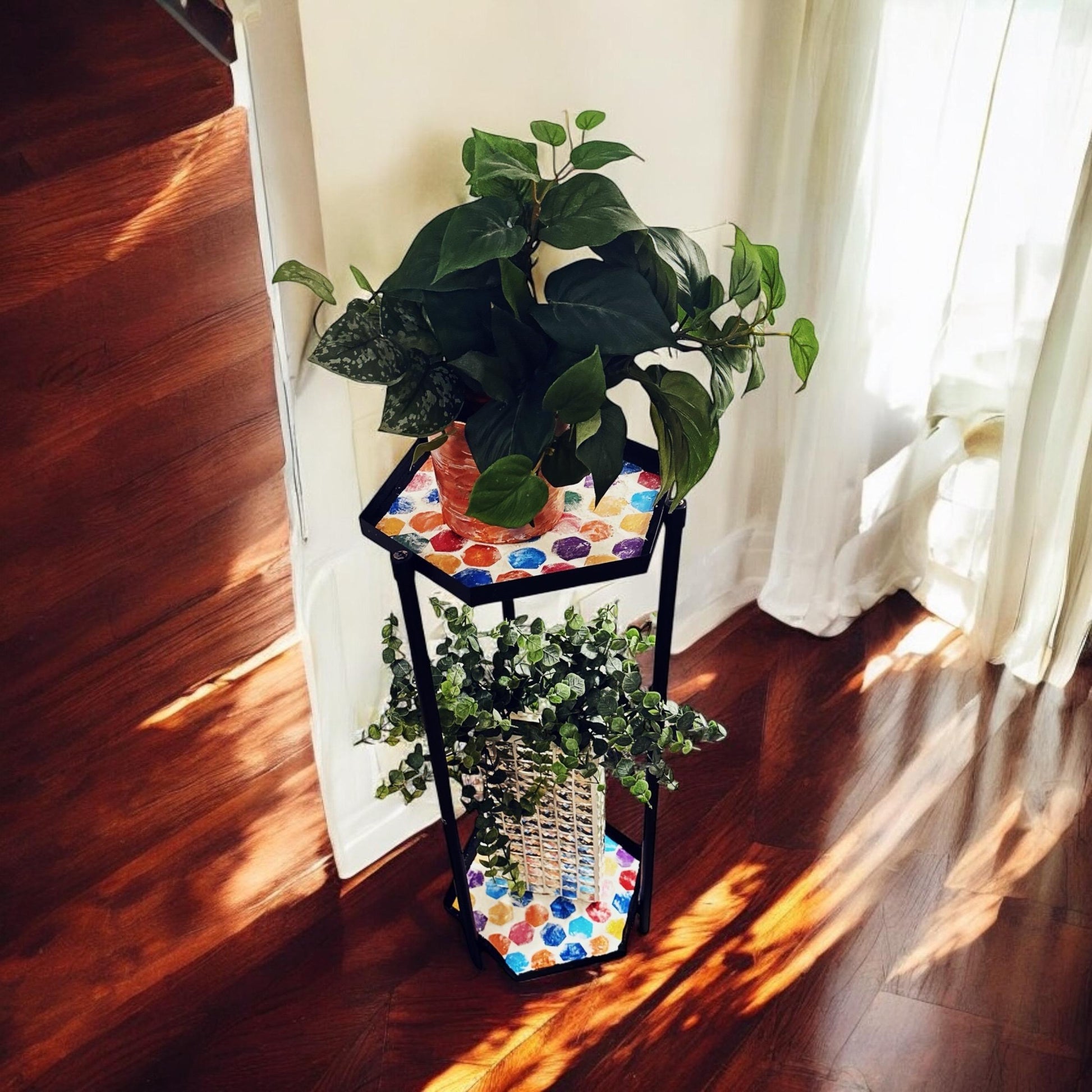 Handcrafted 2-tier rainbow mosaic plant stand with colorful tiled shelves for indoor or outdoor plants.