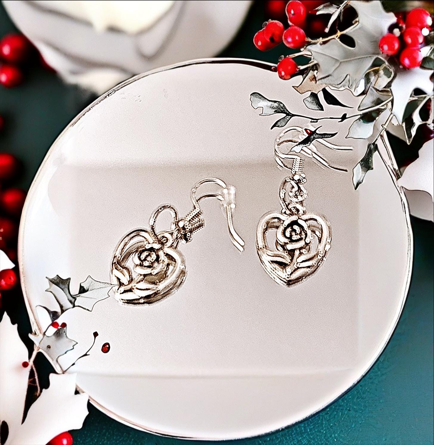 Triple layer heart dangle earrings with gold finish, featuring three connected heart charms hanging from delicate hooks.