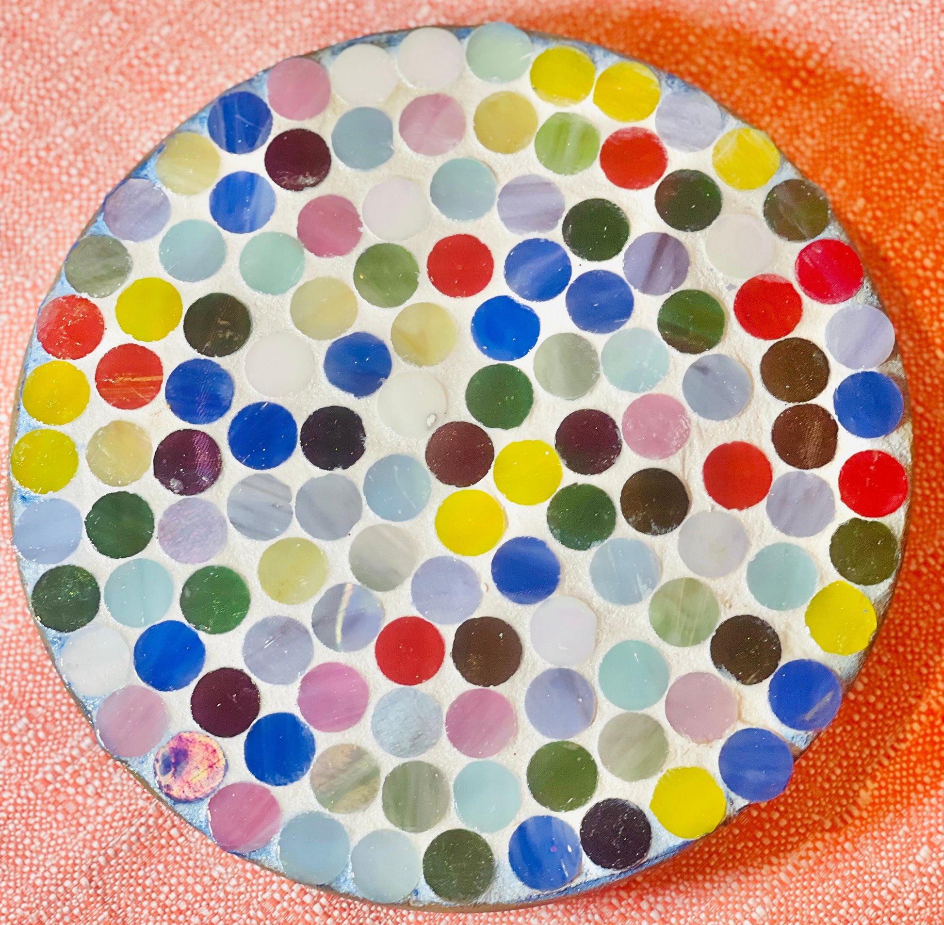 Colorful handcrafted polka dot rainbow mosaic plant stand with three legs, designed by Miss Bette's Creations.