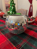 Artisanal disco ball globe vase with mirrored surface, decorative home decor piece reflecting light and adding modern style.