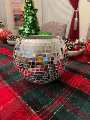 Artisanal disco ball globe vase with mirrored surface, decorative home decor piece reflecting light and adding modern style.