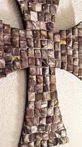 Mother of Pearl mosaic cross with iridescent tiles, featuring intricate design and shimmering pearl accents.