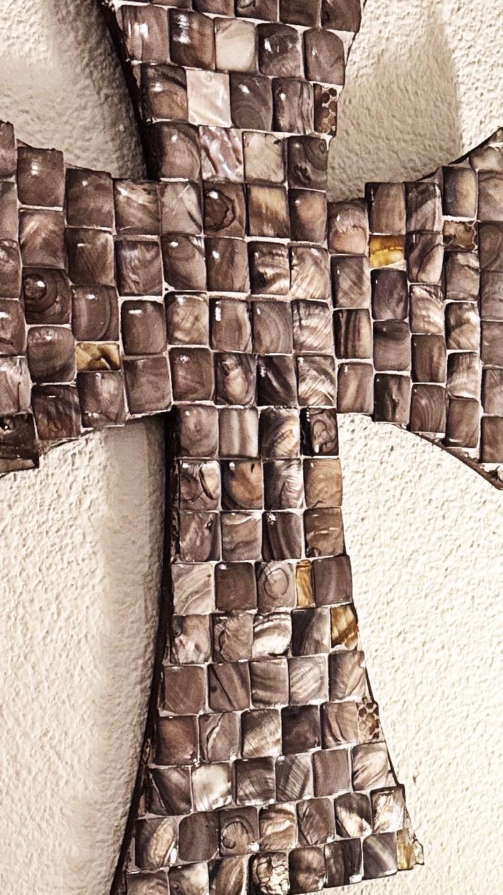 Mother of Pearl mosaic cross with iridescent tiles, featuring intricate design and shimmering pearl accents.