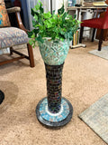Handcrafted mosaic pedestal planter with colorful tile design, perfect for indoor or outdoor plant displays.