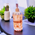 Handcrafted mosaic soap and lotion dispenser set with colorful tile designs, perfect for bathroom or kitchen decor.