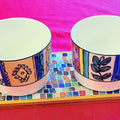 Ceramic trivet, spoon rest, or plant stand with decorative design, suitable for kitchen or tabletop use.