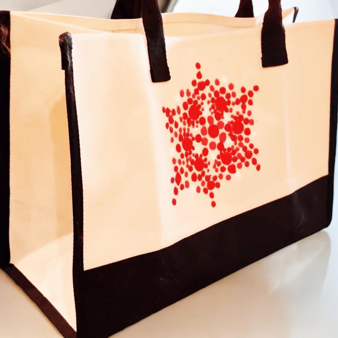 Large white and red custom canvas bag with sturdy handles, ideal for casual use or shopping.