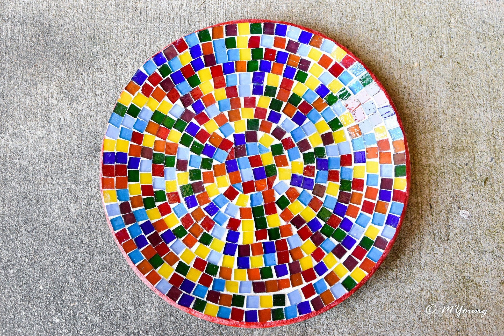 Colorful rainbow mosaic decorative wall plate with vibrant geometric patterns, perfect for wall decor.
