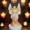 Ethereal Guardian Angel statue with detailed wings and flowing robes, made of stone or resin, representing protection and serenity.