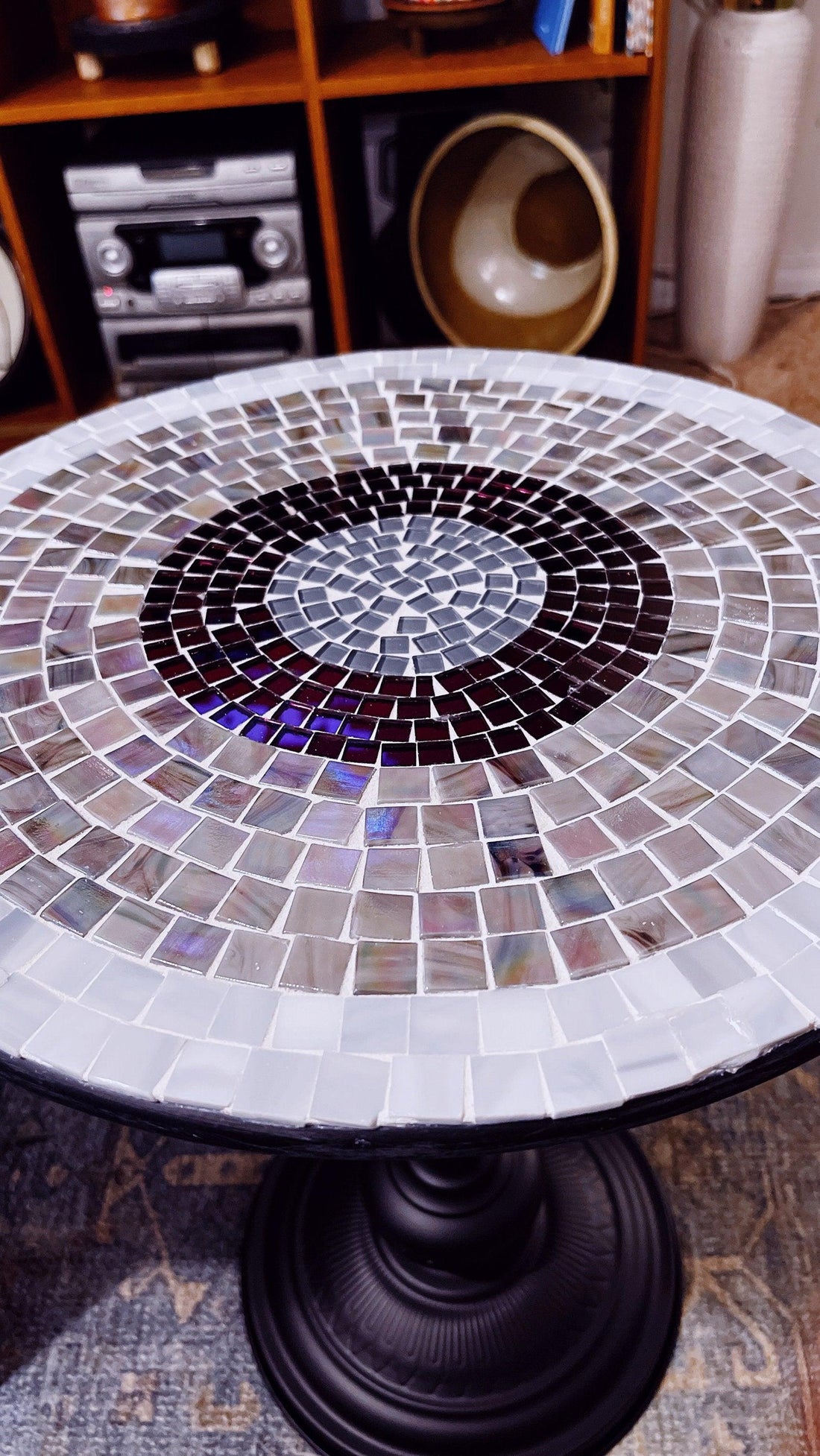 Round side table with 15-inch diameter, 20-inch tall iridescent gray and purple mosaic top on black metal base.