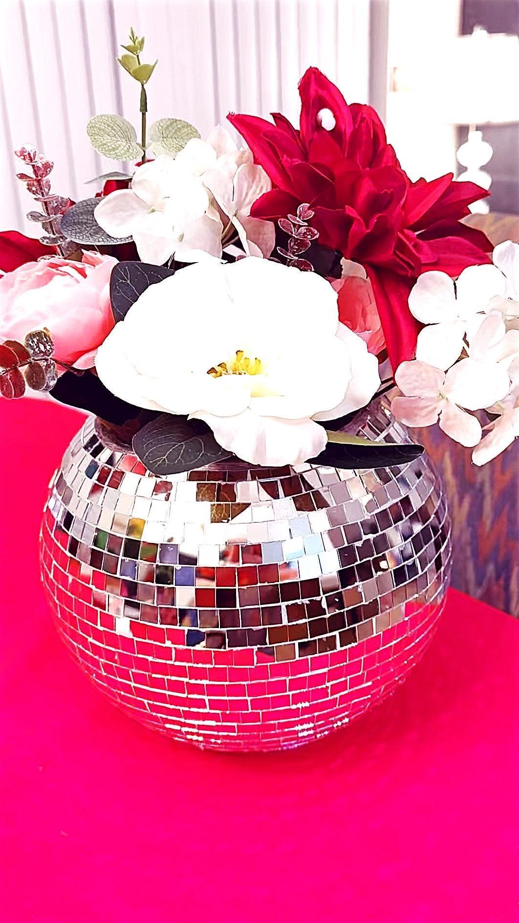 Mirror ball disco globe vase with reflective surface and spherical shape, perfect for decorative floral arrangements.
