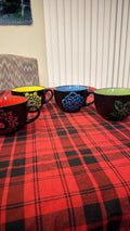 Handpainted extra large coffee mug from My Store with colorful floral design and sturdy ceramic handle.
