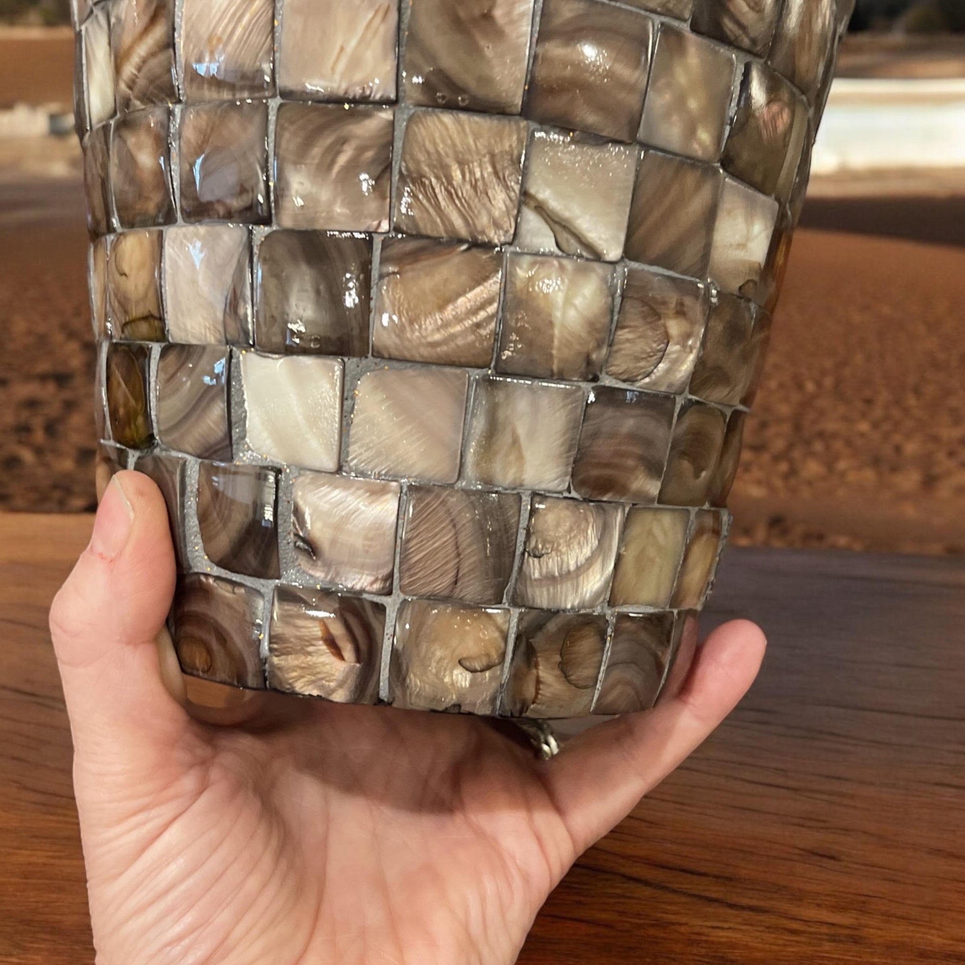 Handcrafted bronze and pearl mosaic planter with intricate design, showcasing a decorative flowerpot for indoor or outdoor use.