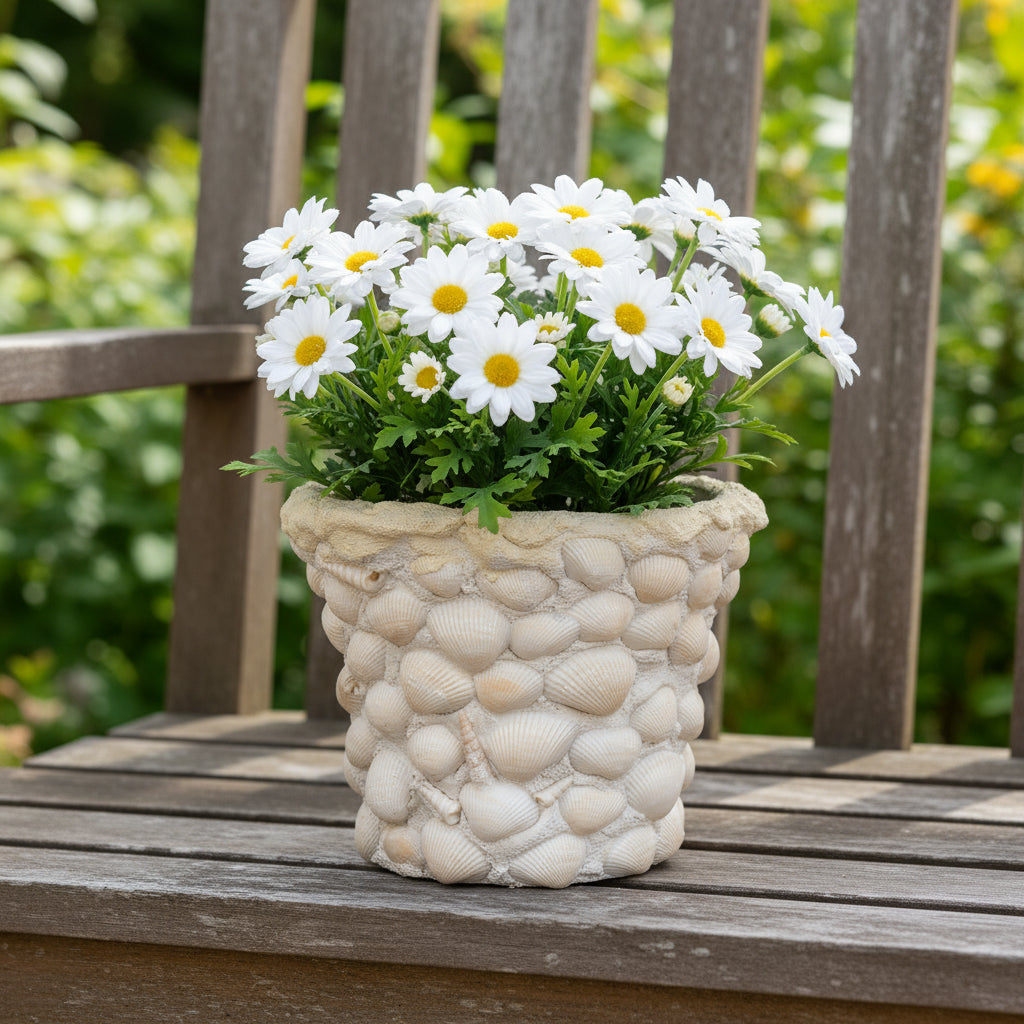 Handcrafted seashell mosaic plant pot with colorful shell patterns, perfect for indoor or outdoor decorative gardening.