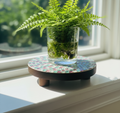 Handcrafted pink and green mosaic plant stand by Miss Bette's Creations, featuring colorful tile design and sturdy metal legs.