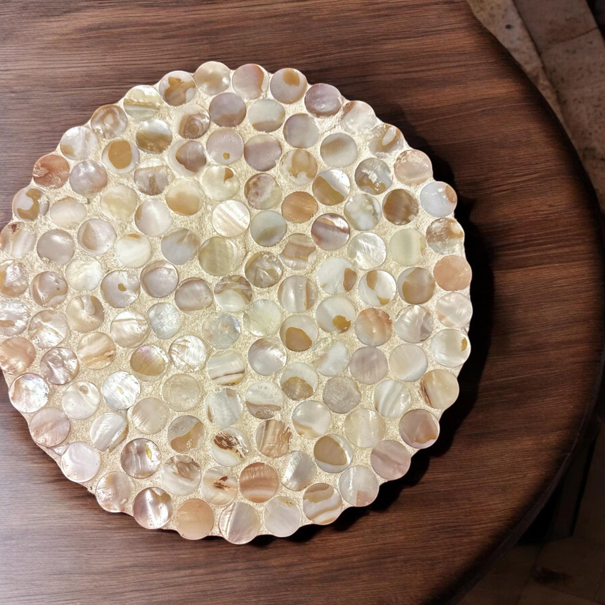 Decorative 10-inch scalloped plant stand with a mother of pearl finish, featuring a stylish design for indoor plants.