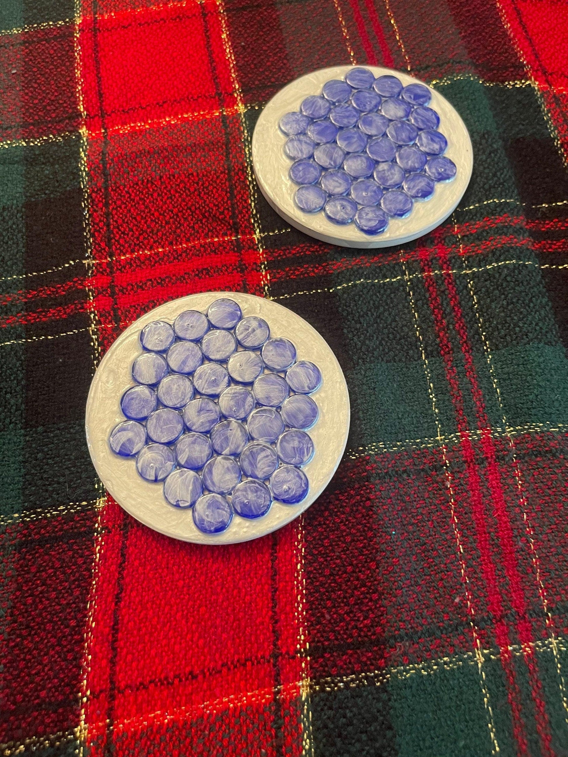 Blue marble mosaic coaster with artisanal design, featuring intricate patterns and a polished surface for decorative use.