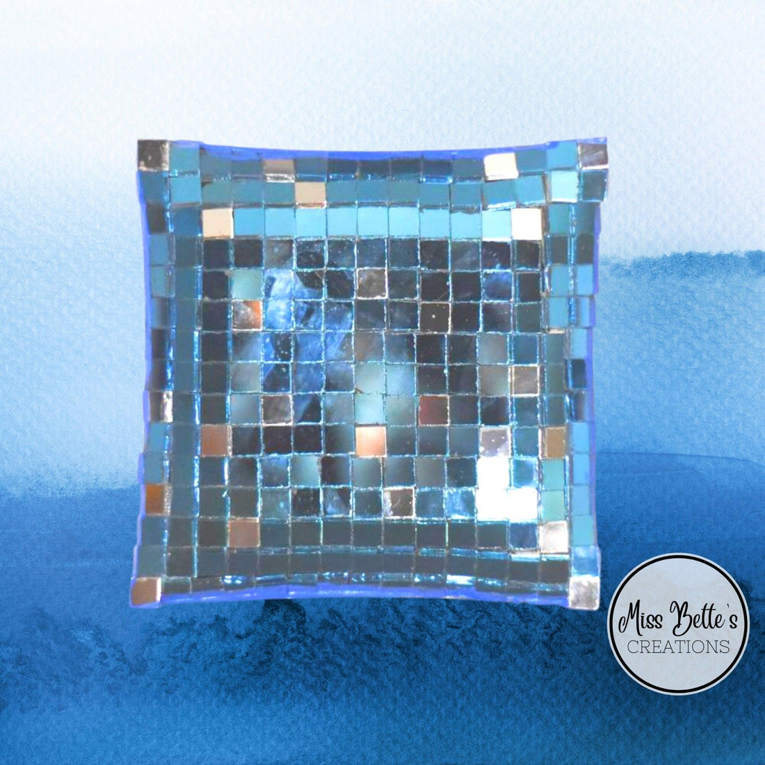 Handcrafted mosaic mirror glass dish with colorful tile patterns, showcasing intricate design and reflective surface.