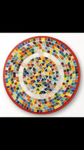 Colorful handcrafted mosaic fruit bowl with vibrant glass pieces, showcasing intricate design and bright fruit motifs.