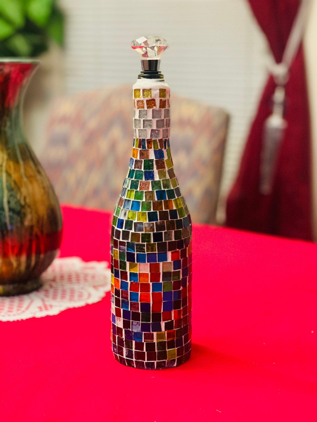 Stained glass look wine decanter featuring colorful stained glass design, elegant glass body, and tapered neck for pouring.