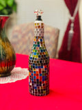 Stained glass look wine decanter with intricate colorful glass design, elegant and decorative for wine serving.