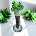 Colorful handcrafted mosaic pedestal planter with floral patterns, perfect for indoor or outdoor garden displays.