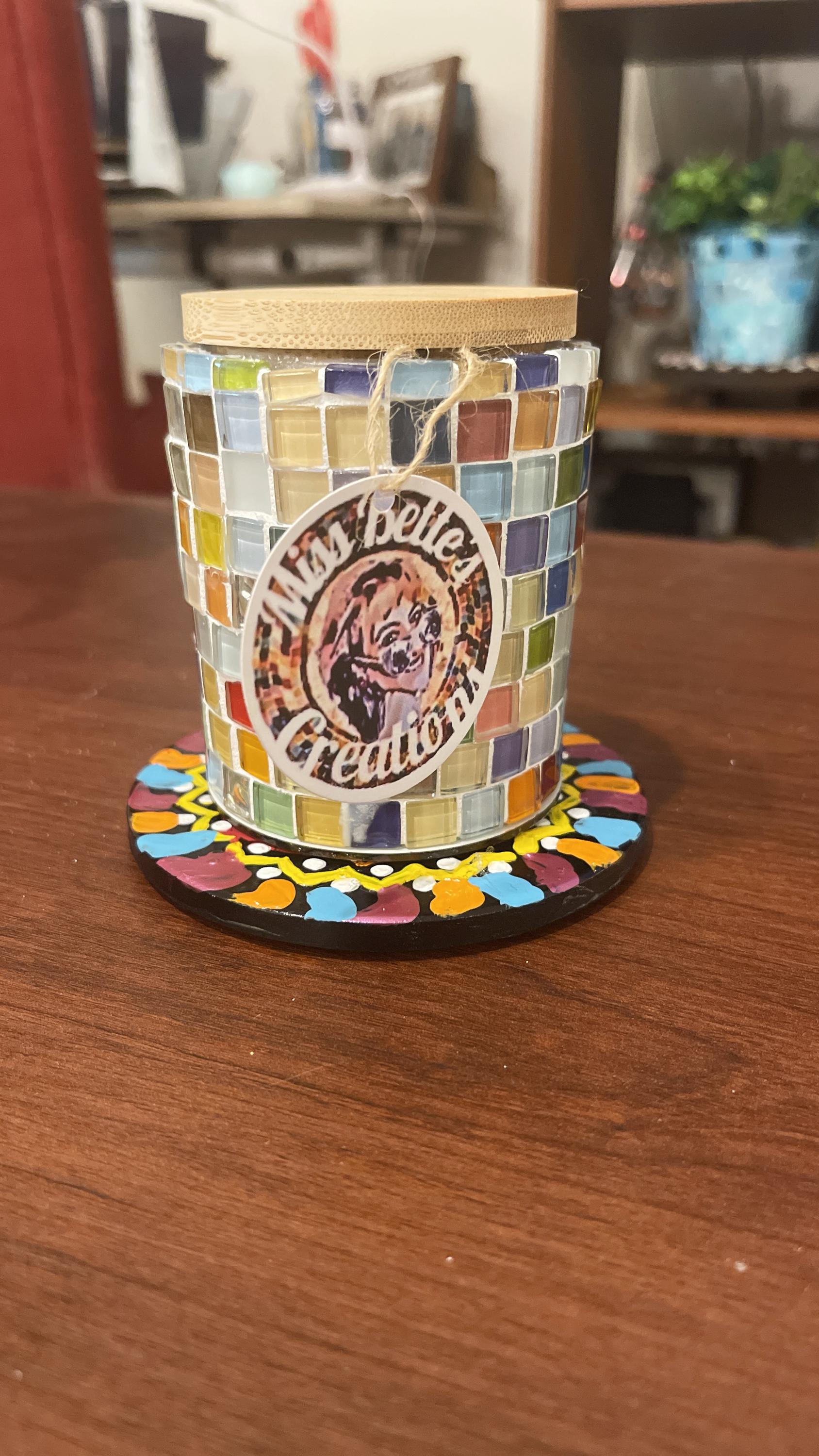 Handcrafted mosaic glass jar with bamboo lid, artisan decorative storage container for home or kitchen use.