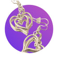 Silver triple layer heart dangle earrings with intricate design, stylish jewelry accessory for women.