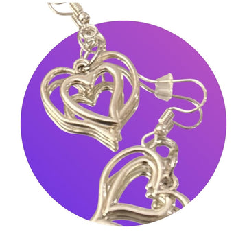 Silver triple layer heart dangle earrings with intricate design, stylish jewelry accessory for women.