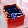 Deep blue glass cuff bracelet with smooth, rounded edges and a shiny finish, crafted for stylish wrist accessorizing.