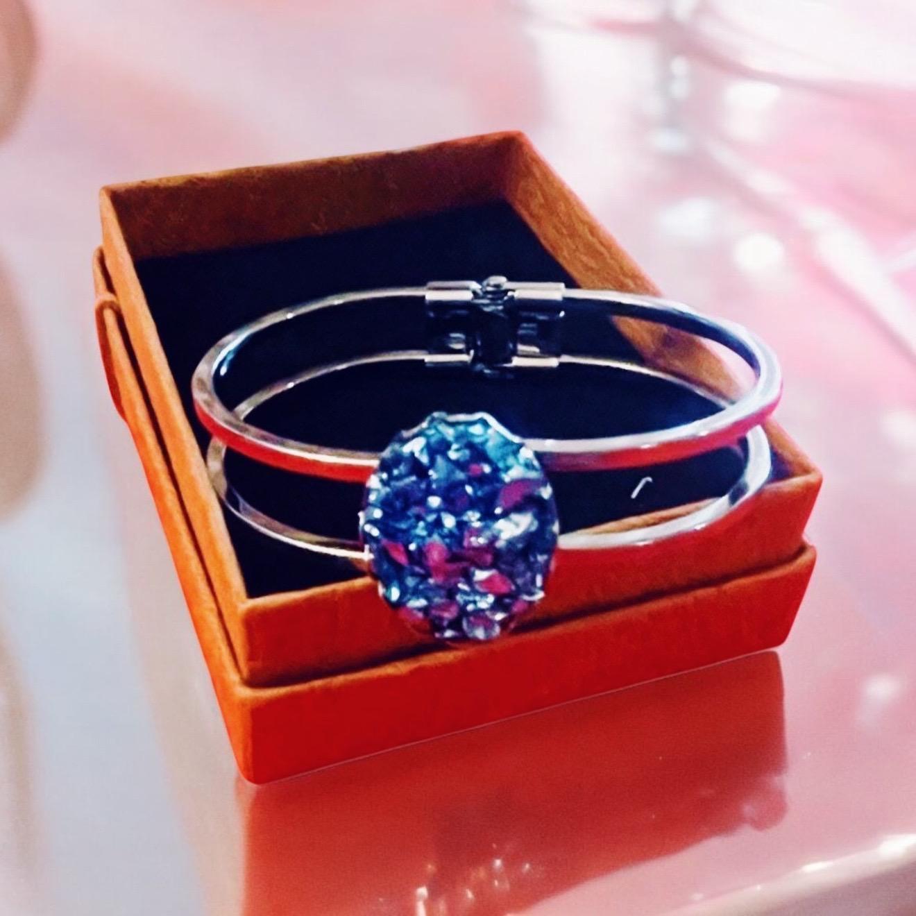 Deep blue glass cuff bracelet with smooth, rounded edges and a shiny finish, crafted for stylish wrist accessorizing.