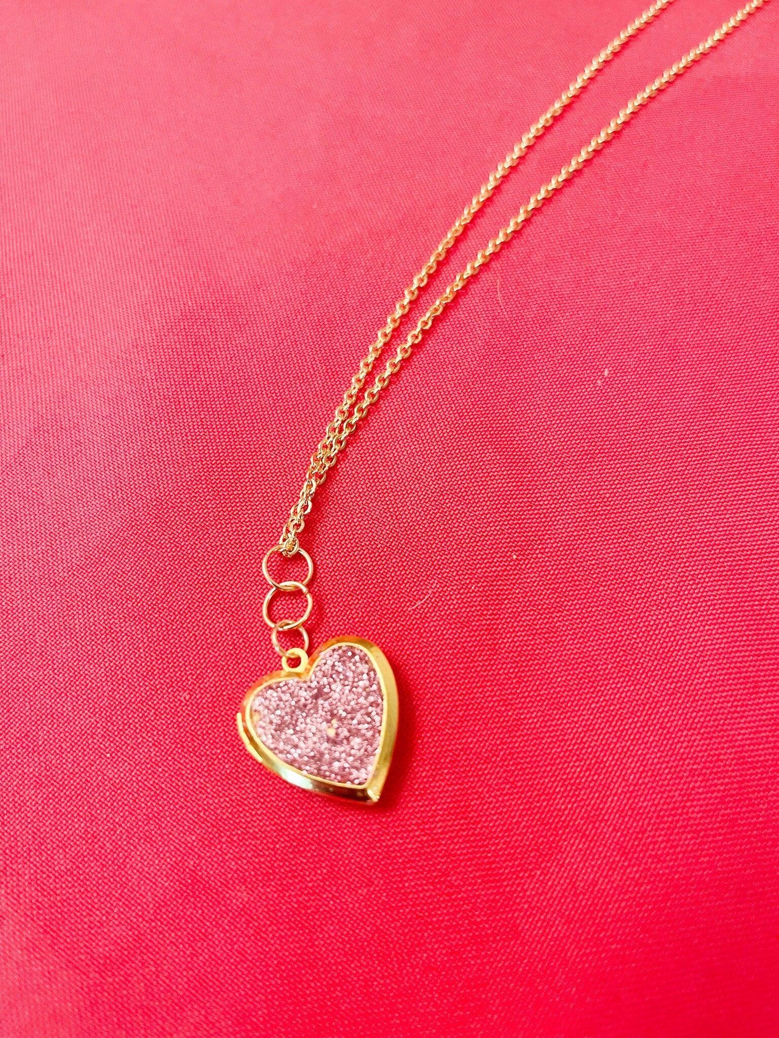 Gold sparkling rose-shaped heart locket with intricate details, ideal for jewelry lovers seeking elegant accessories.