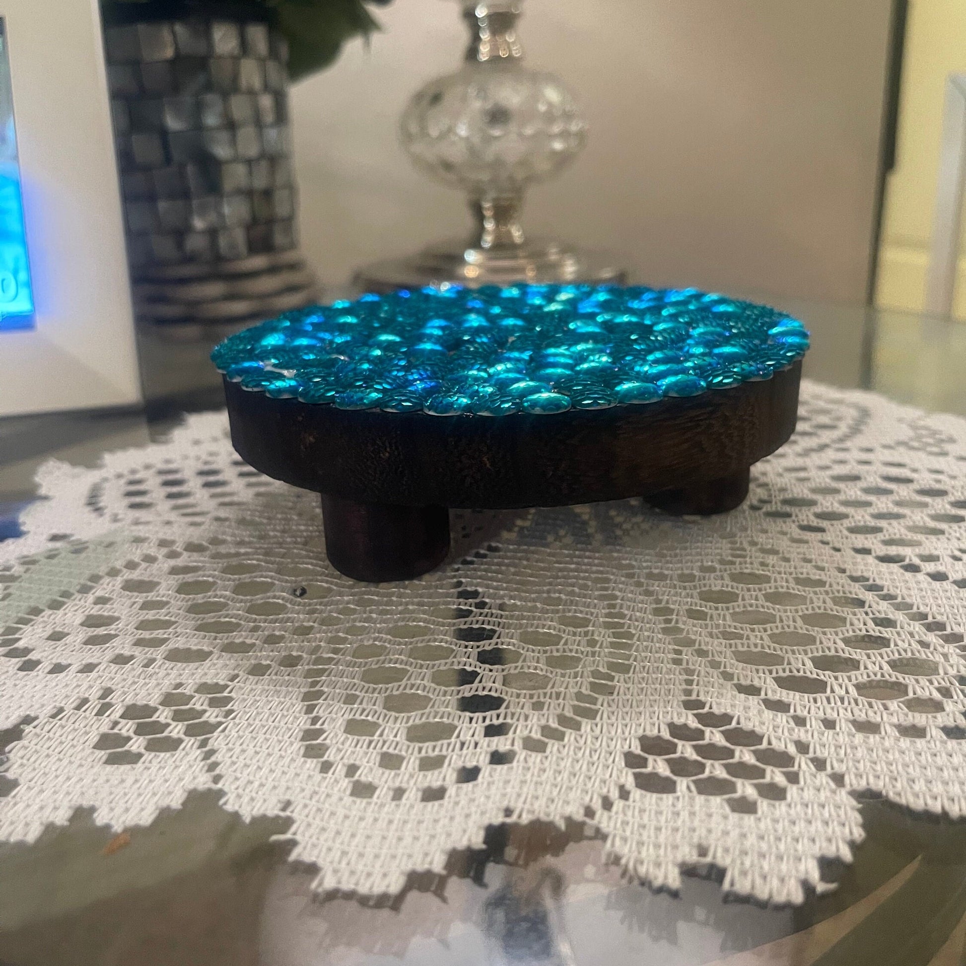 Artisanal turquoise cabochon mosaic plant stand by Miss Bette's Creations featuring colorful glass tiles and a sturdy base.