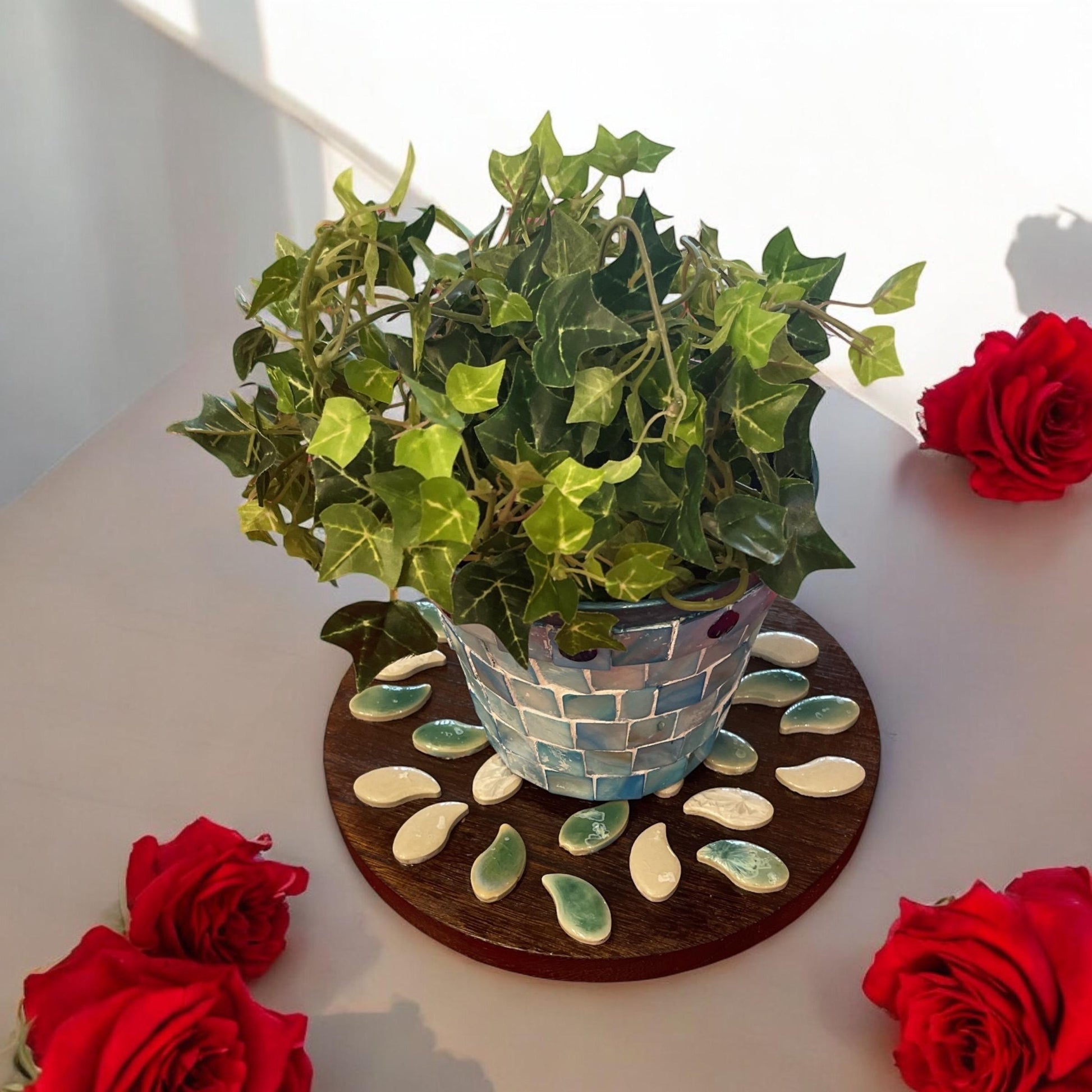 Handcrafted petal mosaic wooden plant stand with multiple tiers, featuring colorful mosaic petal design and sturdy wooden construction.